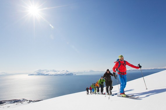 Get ready for the winter in 2015 with AscentDescent "The Lyngen Mountain Guides". This photo is from one of our ski by boat tours with our base in Lyngen in the background. 25 min away with the boat! Photo: Fredrik Schenholm